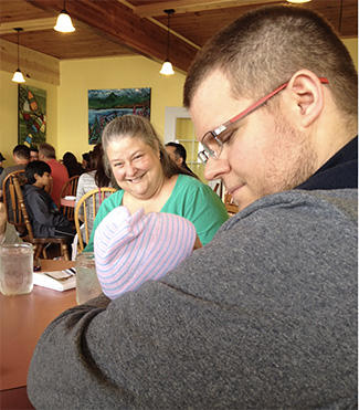 tenderness - man holding baby